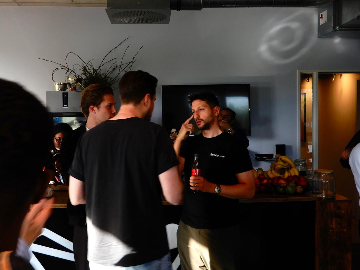 Students chatting with Formlabs staff after the tour